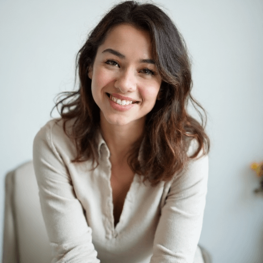 Smiling, successful woman seated in a chair.