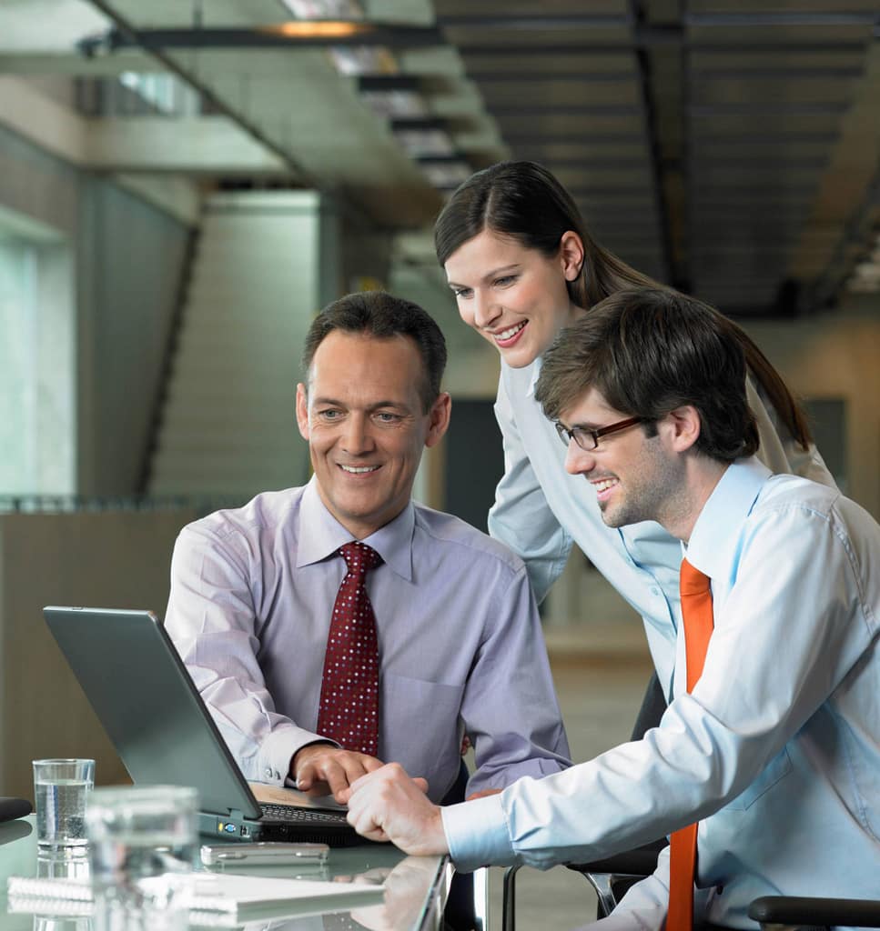 IT consultants working together at a computer